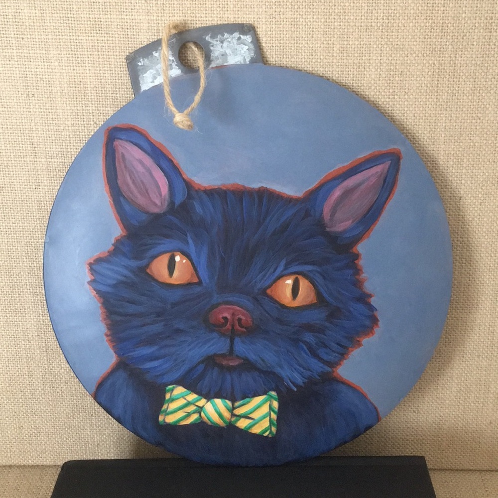 Hand painted cat ornament on 8” round tin